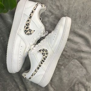Woman’s Nike court vision low sneaker with cheetah print Nike logo